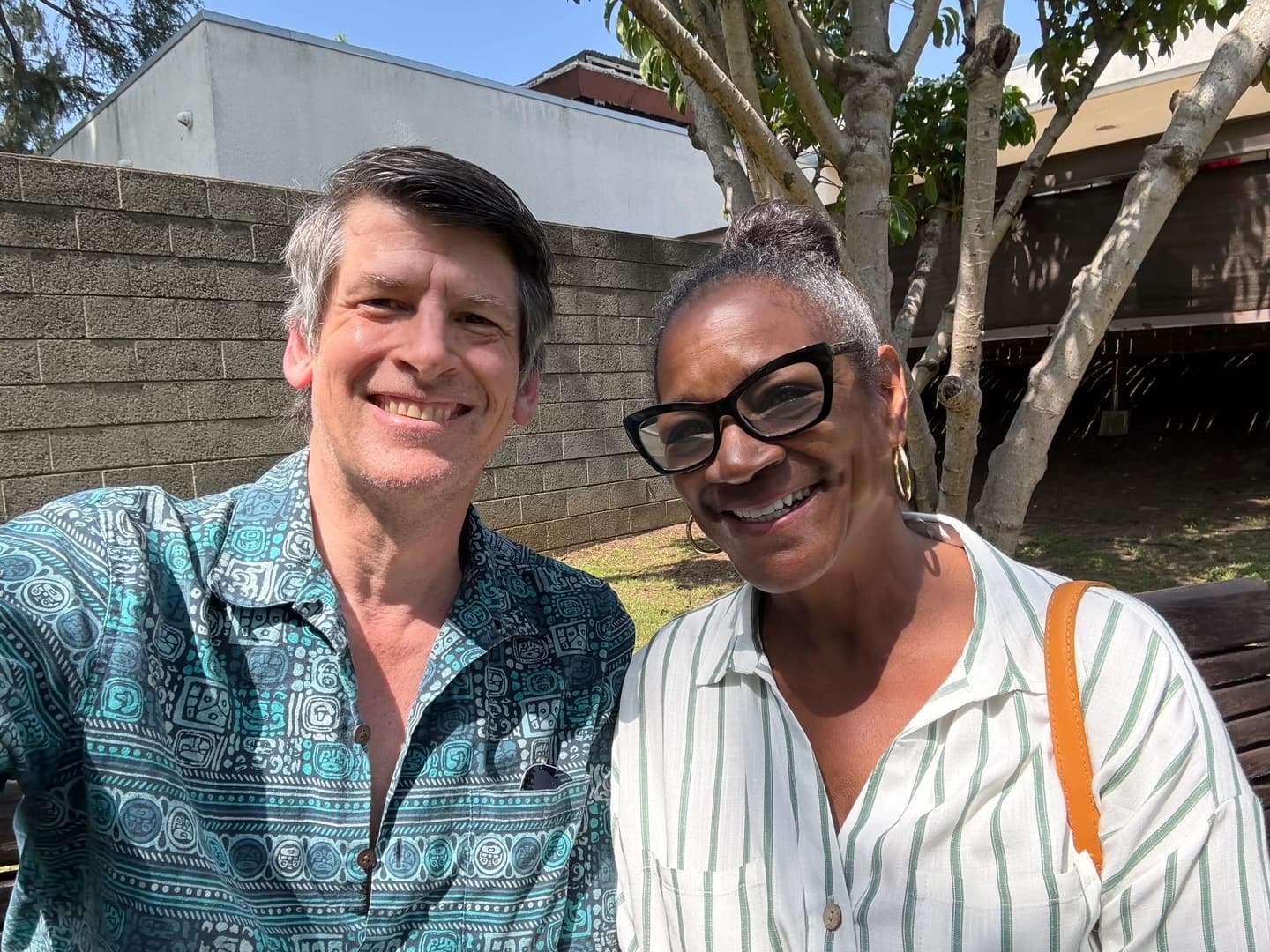 Notes from the Fires host John Rabe with Veronica Jones, the president of the Altadena Historical Society, outside the Altadena Public Library.